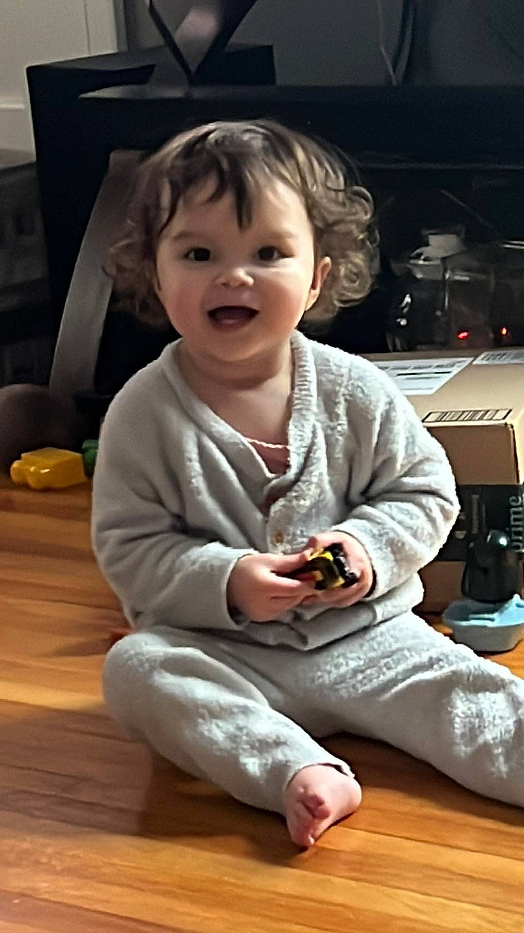 Clementine joined the competition — help win amazing prizes! baby, baby_toddler_clothing, cheek, child, comfort, facial_expression, flooring, fun, hairstyle, happy, hardwood, human_body, joy, nose, person, sitting, skin, smile, standing, toddler