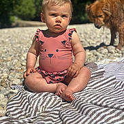 Lou participe au concours pour gagner de l'argent avec cette photo : animal, baby, cat_design, child, dog, golden_dog, grass, nature, outdoor, pet, pink, portrait, rocks, serious_face, sitting, striped_blanket, summer, sunlight, swimsuit, trees