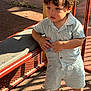 Alexander joined the competition — help win amazing prizes! boy, child, clothing, curious, face, floor, hair, hands, metal, outdoor, playground, shadow, shirt, shoes, shorts, sneakers, standing, sunlight, texture, toddler