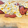Anyia joined the competition — help win amazing prizes! baby, infant, flower_pattern, headband, yellow, fabric, laying_down, cute, child, newborn, skin, arm, hand, dress, soft_texture, portrait, indoors, relaxed, small, adorable