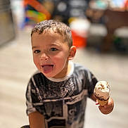 Jayden joined the competition — help win amazing prizes! child, boy, ice_cream, tongue_out, playful, indoor, blurred_background, short_hair, casual_clothing, smiling, food, cone, happy, cute, person, portrait, colorful, fun, young, sweet_treat