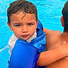 Jayden joined the competition — help win amazing prizes! adult, backyard, blue, child, expression, face, floaties, fountain, hair, holding, outdoor, person, recreation, skin, summer, swimming, swimming_pool, toddler, water, water_safety