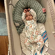 Aliza joined the competition — help win amazing prizes! baby, sleeping, onesie, floral_pattern, bassinet, pillow, pacifier, infant, sleep, child, cozy, bed, rest, cute, peaceful, indoors, wood_floor, blanket, fabric, newborn