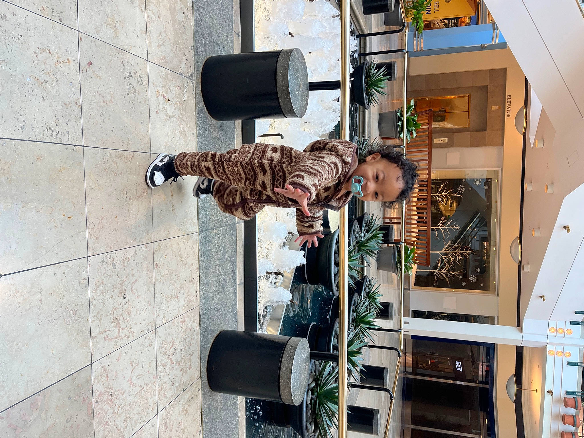 Kameron joined the competition — help win amazing prizes! automotive_tire, building, city, facade, machine, metal, pedestrian, person, room, shadow, sidewalk, street, t_shirt, tire, wheel, wood