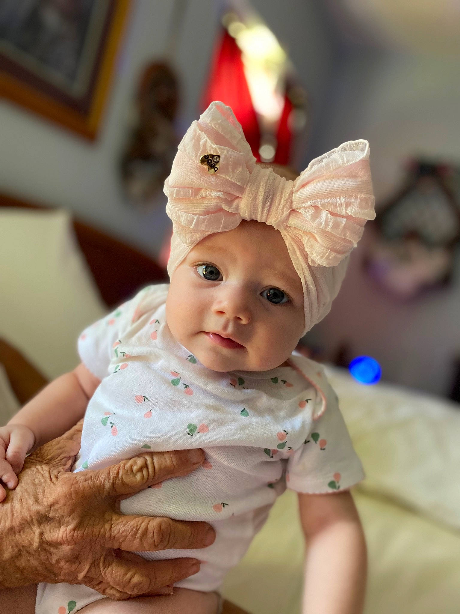 Madison is registered to the contest to win money with this photo: baby, baby_toddler_clothing, cap, cheek, child, costume_hat, event, eye, fashion_accessory, fun, gesture, happy, hat, headwear, peach, person, picture_frame, sitting, skin, sleeve