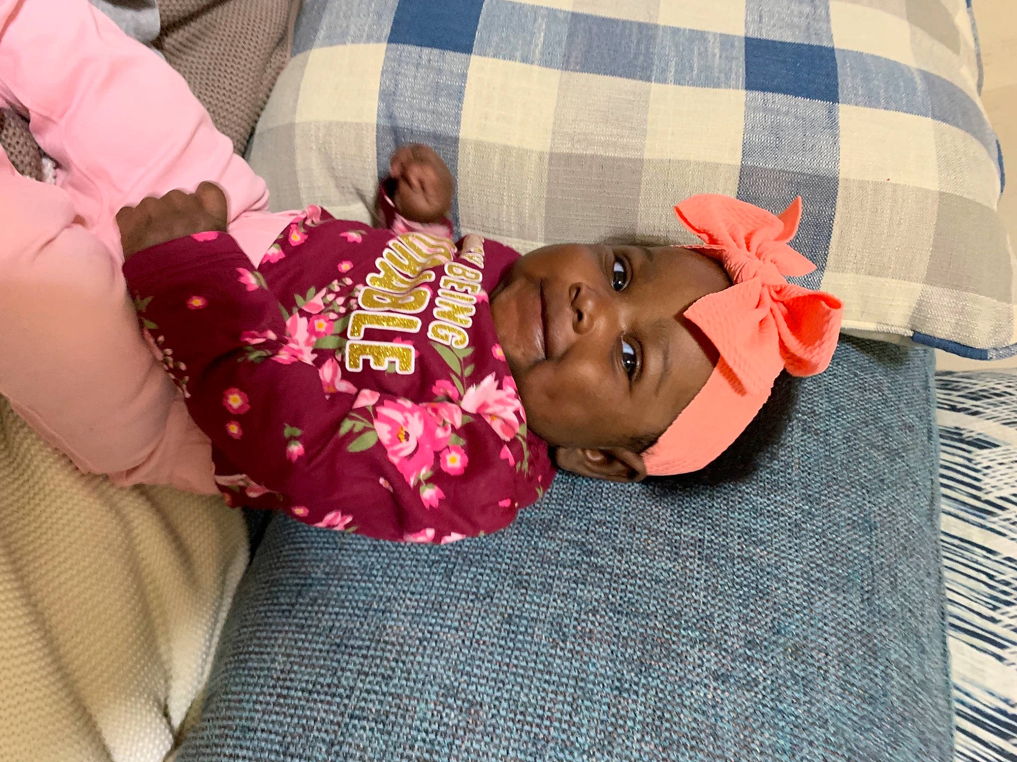 Ariya is registered to the contest to win money with this photo: baby, baby_toddler_clothing, child, comfort, fashion_accessory, happy, hat, headwear, linens, magenta, pattern, person, pink, plaid, skin, sleeve, smile, sunglasses, t_shirt, tartan