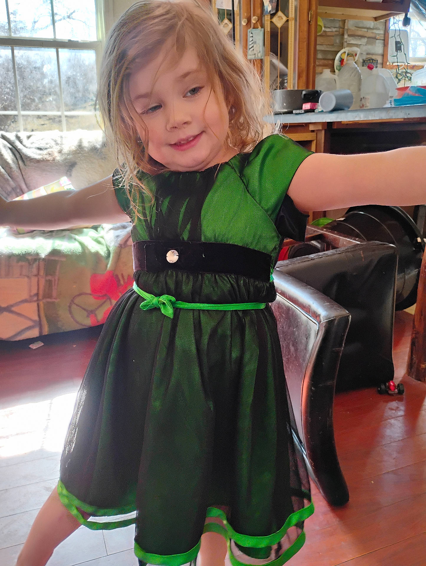 Jenna is registered to the contest to win money with this photo: accessories, child, clothing, couch, dress, eveningdress, face, female, footwear, formalwear, furniture, girl, hardwood, head, highheel, person, plywood, shoe, velvet, wood