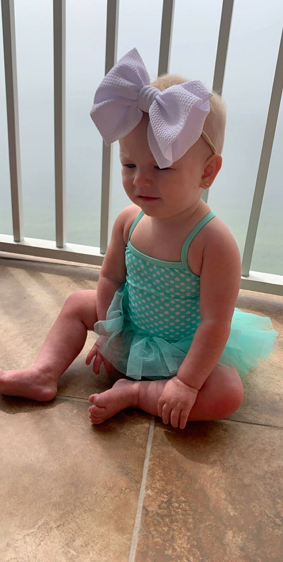 Brinleigh Kate joined the competition — help win amazing prizes! baby, baby_toddler_clothing, child, clothing, costume, floor, flooring, hair_accessory, headband, headgear, headwear, pattern, person, play, sitting, skin, sportswear, toddler