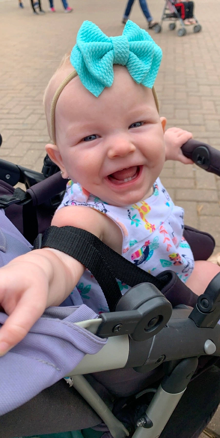 Brinleigh Kate is registered to the contest to win money with this photo: baby, baby_carriage, baby_products, cheek, child, ear, headband, headgear, headwear, person, product, smile, toddler