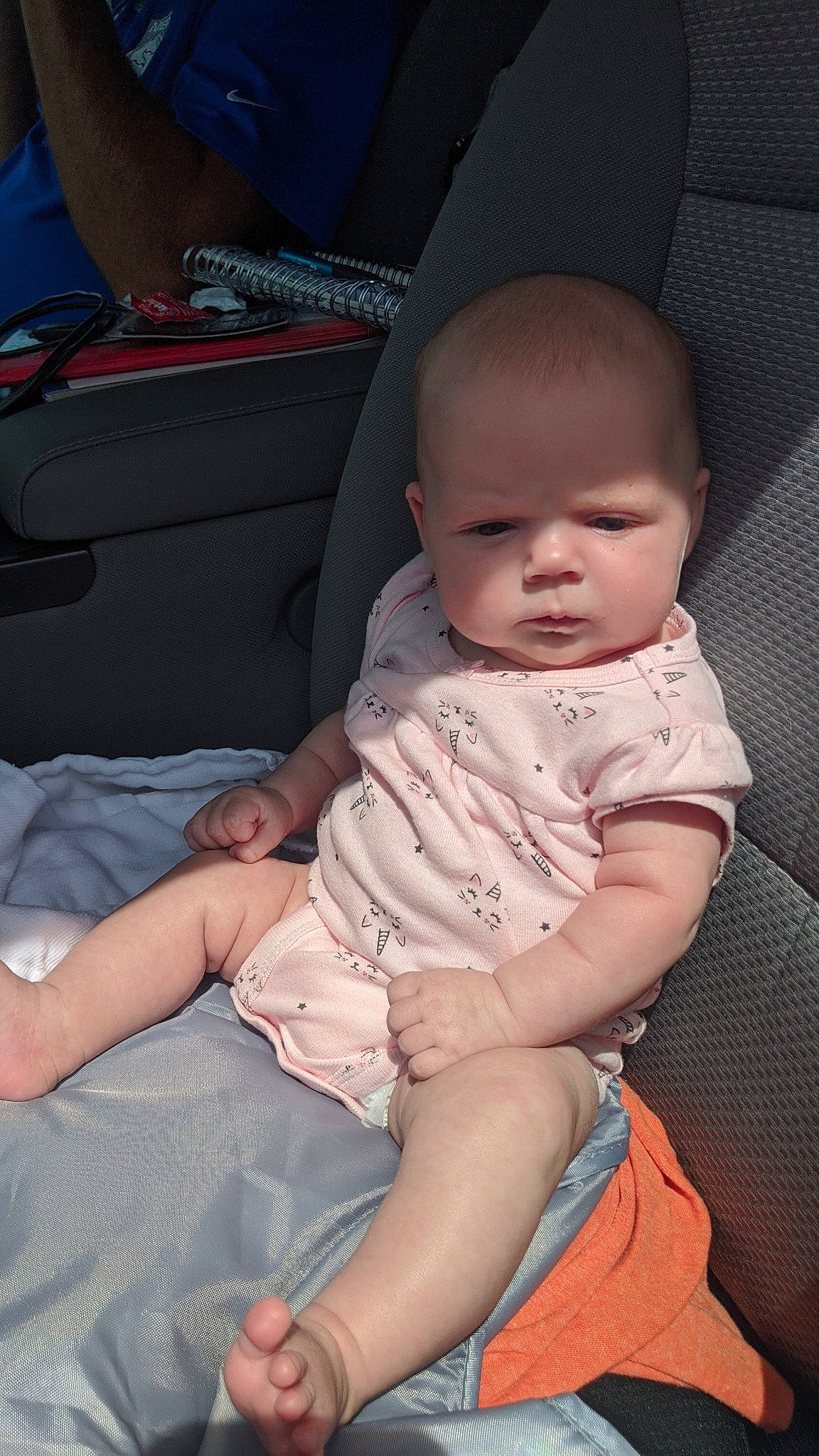 Kallie is registered to the contest to win money with this photo: arm, baby, cheek, child, eye, finger, hand, leg, person, sitting, skin, toddler