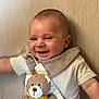 Emilio participe au concours pour gagner de l'argent avec cette photo : baby, smiling, infant, plush_toy, teddy_bear, clothing, bib, pacifier, happy, cute, child, portrait, indoor, soft_lighting, person, fabric, knitwear, toy, closeup, young_child