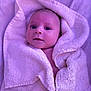 Emilio participe au concours pour gagner de l'argent avec cette photo : baby, towel, blanket, infant, face, portrait, wrapped, cute, soft, cozy, child, skin, head, expression, newborn, lying_down, indoors, warm, pink_tint, comfort
