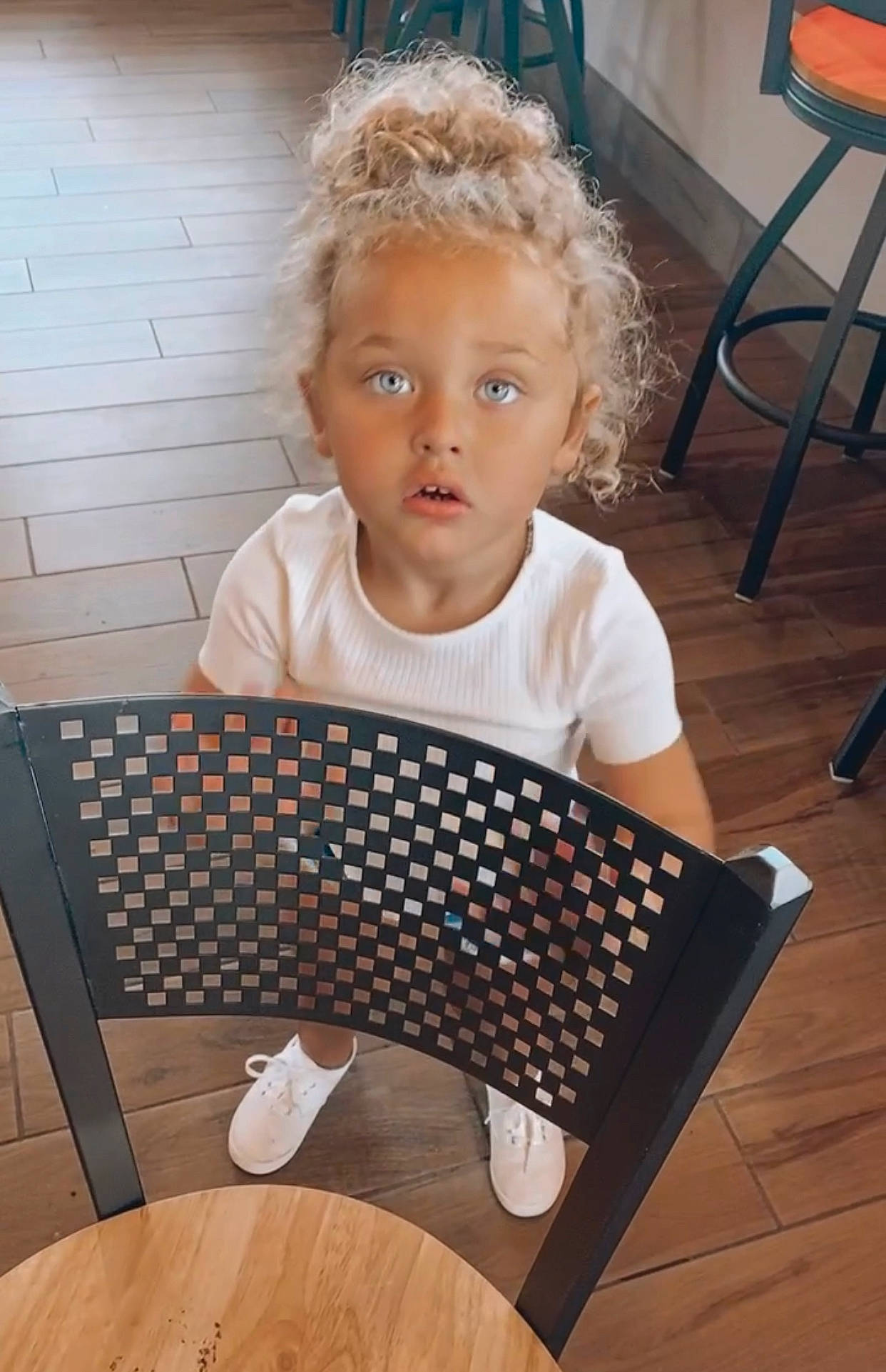 Jaelynn is registered to the contest to win money with this photo: baby_toddler_clothing, beauty, chair, child, comfort, floor, flooring, furniture, glasses, hairstyle, happy, hardwood, human_body, organ, pattern, person, room, sitting, surprise, t_shirt