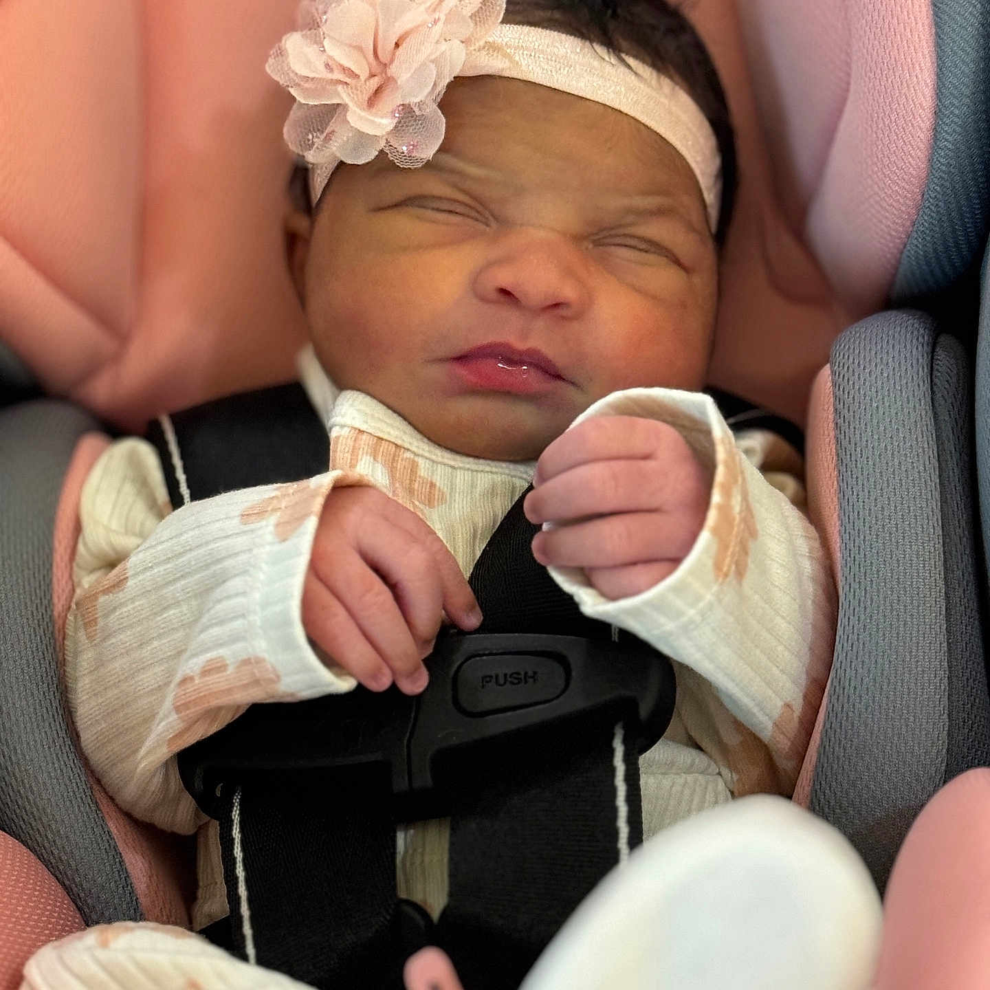 Desiree joined the competition — help win amazing prizes! baby, car_seat, child, closeup, clothing, cute, flower, hands, harness, headband, indoor, infant, newborn, person, pink, portrait, seatbelt, sleeping, soft, white