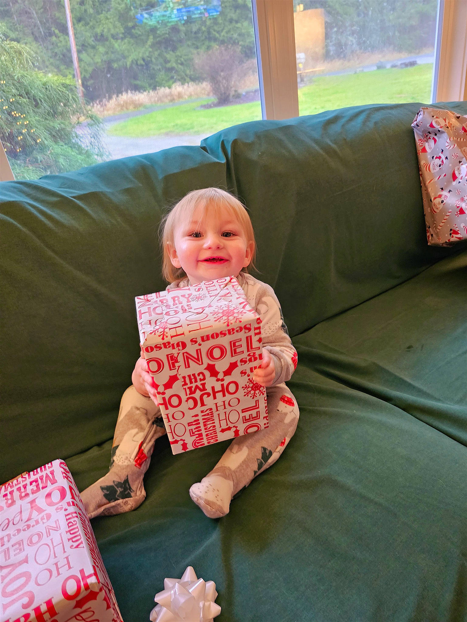 Zaidyn is registered to the contest to win money with this photo: child, comfort, couch, event, eye, face, fun, grass, happy, head, joy, lap, leisure, person, pink, plant, sitting, skin, smile, summer