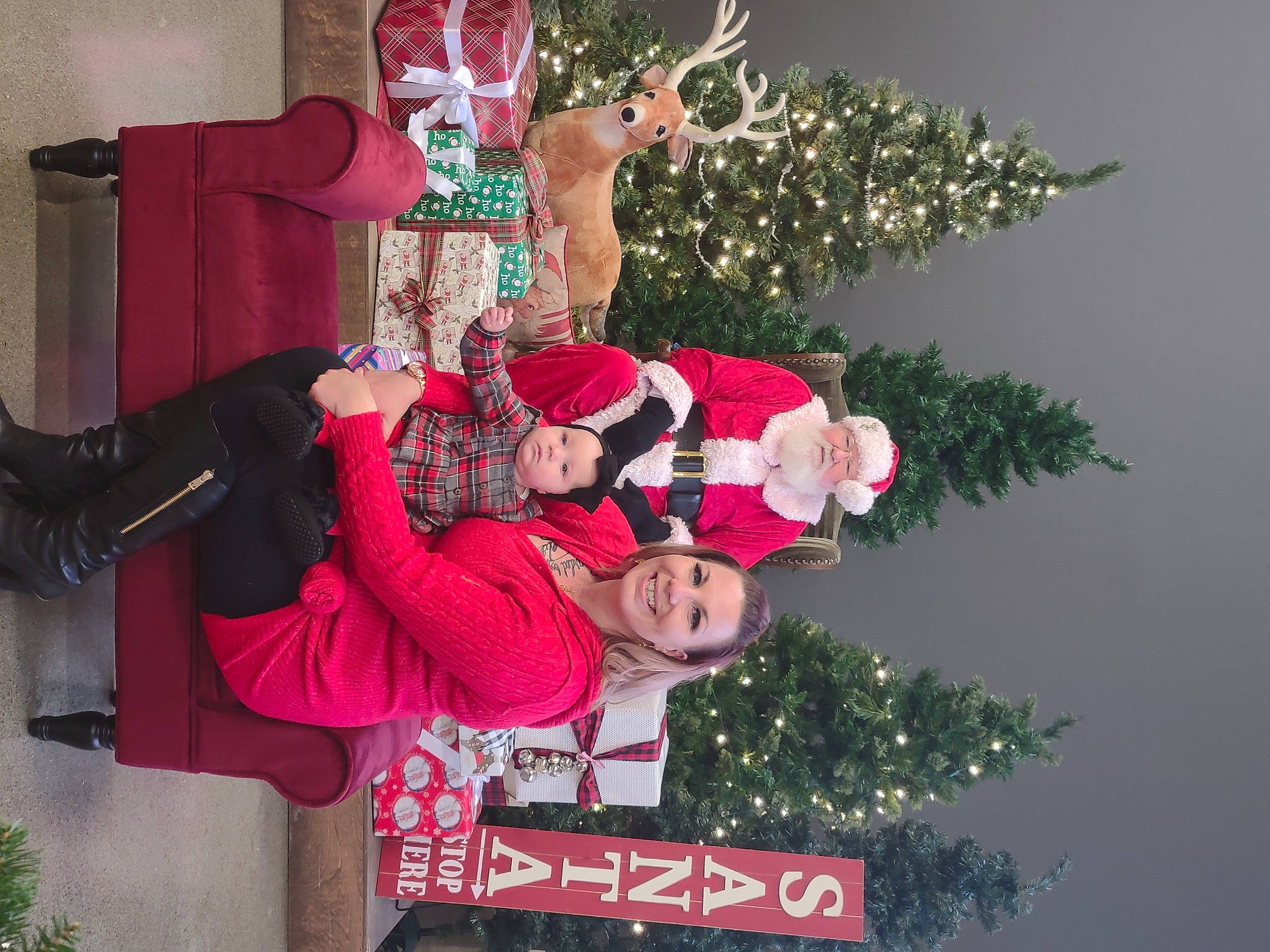 Brooklynn is registered to the contest to win money with this photo: carmine, christmas, christmas_decoration, christmas_eve, christmas_lights, christmas_ornament, christmas_tree, costume, event, fictional_character, headwear, holiday, holiday_ornament, interior_design, joy, lap, ornament, person, red, reindeer