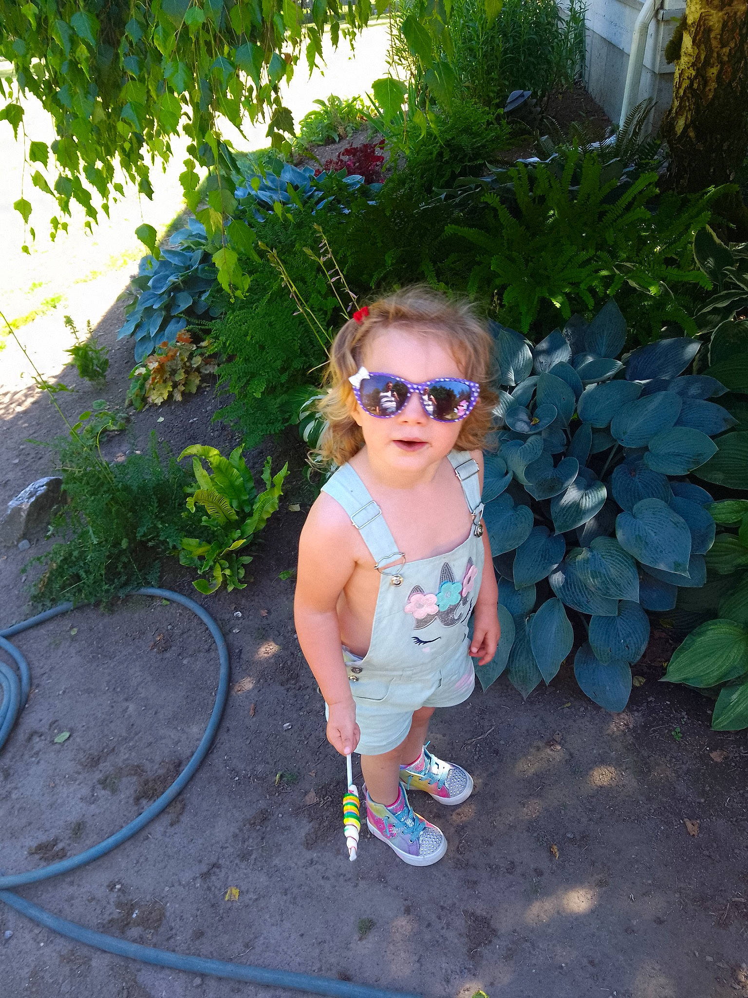 Brooklynn joined the competition — help win amazing prizes! baby_toddler_clothing, child, electric_blue, eyewear, fun, garden, goggles, grass, leaf, leisure, person, plant, recreation, shorts, shrub, smile, sunglasses, toddler, tree, vacation
