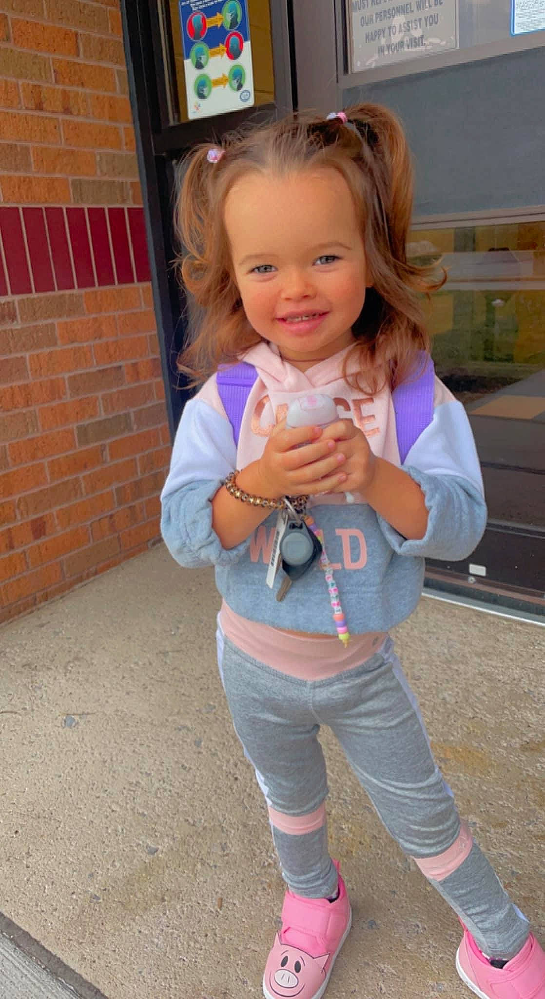 Briella Jade joined the competition — help win amazing prizes! baby_toddler_clothing, child, cool, eye, face, finger, fun, gesture, hand, happy, iris, joint, joy, people, person, pink, sleeve, smile, standing, thumb