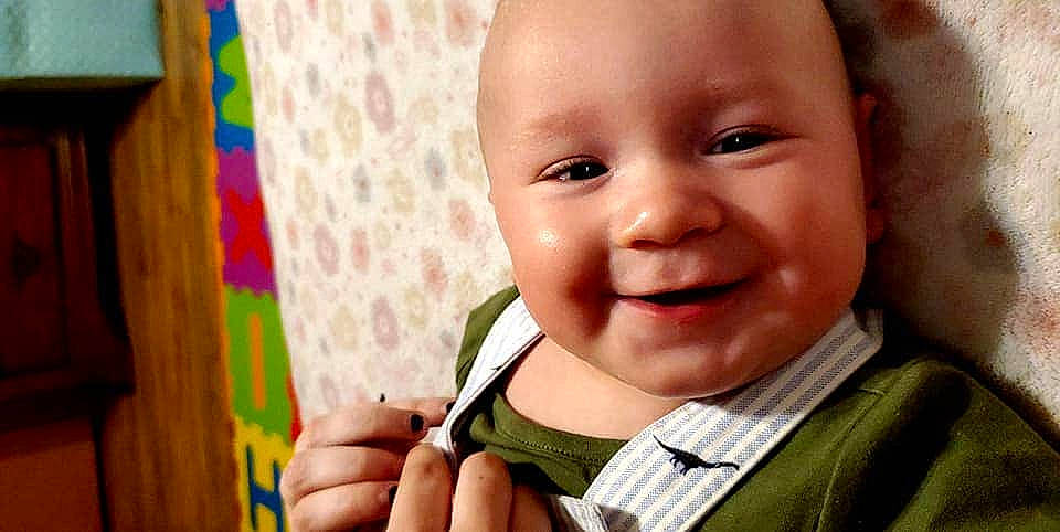 Tracy is registered to the contest to win money with this photo: baby, cheek, child, chin, face, facial_expression, finger, happy, joy, laugh, lip, mouth, nose, person, skin, smile, thumb, toddler