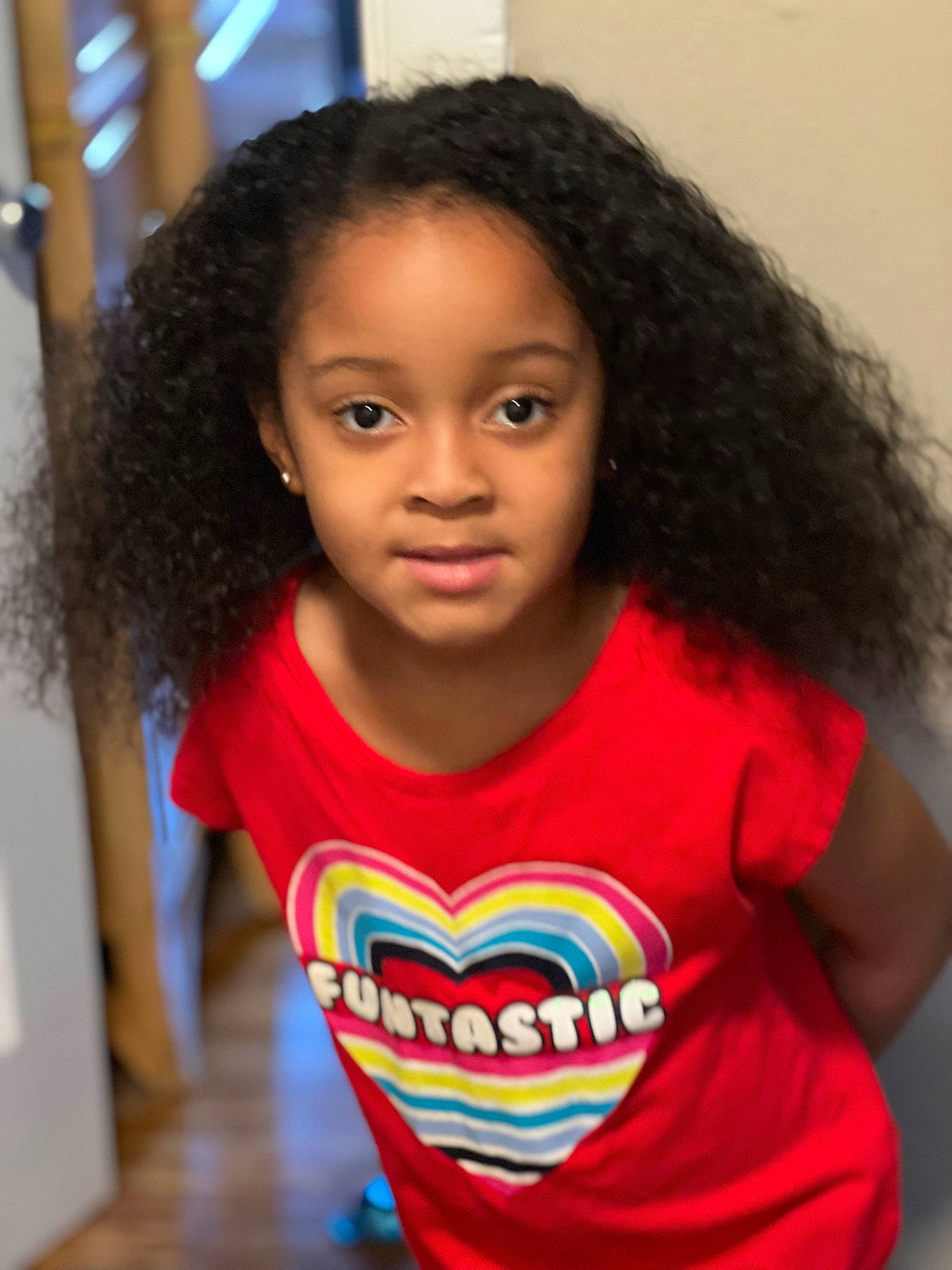 Robyn is registered to the contest to win money with this photo: cheek, chin, eyebrow, facial_expression, fashion, forehead, hair, happy, head, human, jheri_curl, lip, mouth, nose, organ, person, ringlet, sleeve, smile, standing