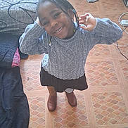 Amelya participe au concours pour gagner de l'argent avec cette photo : beads, bed, blanket, boots, braids, child, cozy, curtain, floor, happy, indoor, pattern, person, playful, room, skirt, smiling, standing, sweater, tile_floor