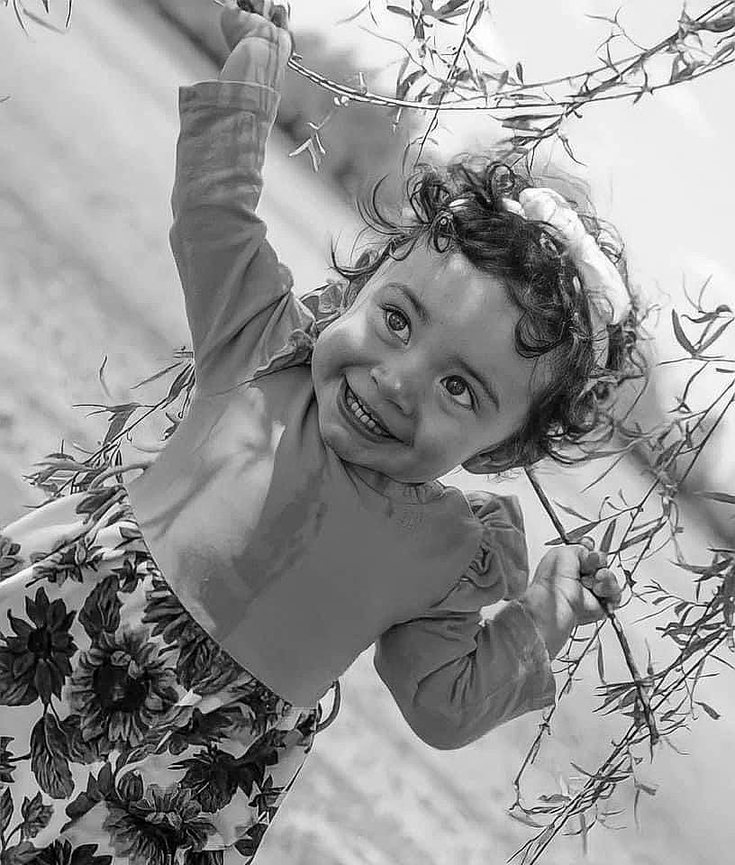 Arya joined the competition — help win amazing prizes! black_and_white, branch, daytime, facial_expression, flash_photography, gesture, grass, hairstyle, happy, human, joy, leaf, monochrome, people_in_nature, person, smile, standing, style, toddler, twig