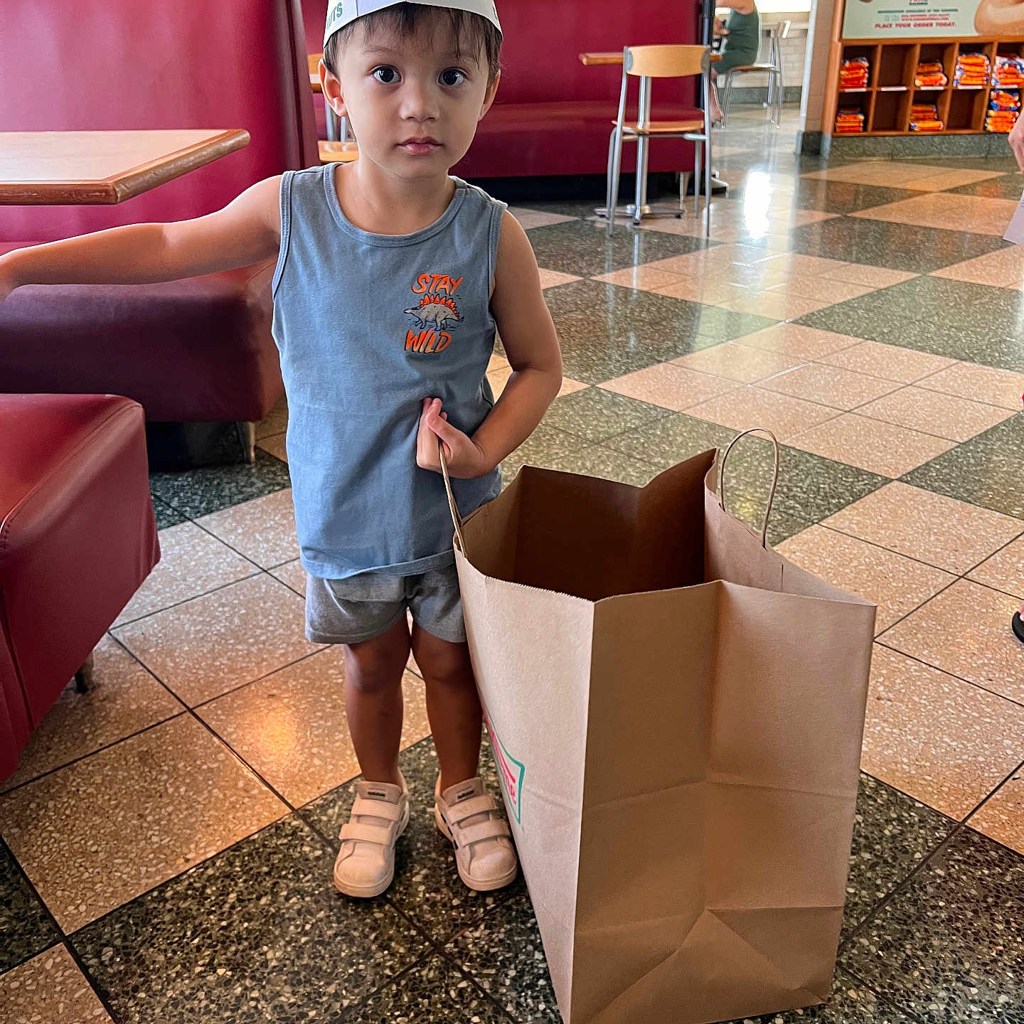 Neo Reeves is registered to the contest to win money with this photo: baseballcap, box, boy, cap, child, clothing, couch, face, footwear, furniture, hat, head, indoors, interiordesign, male, pants, person, photography, portrait, shoe