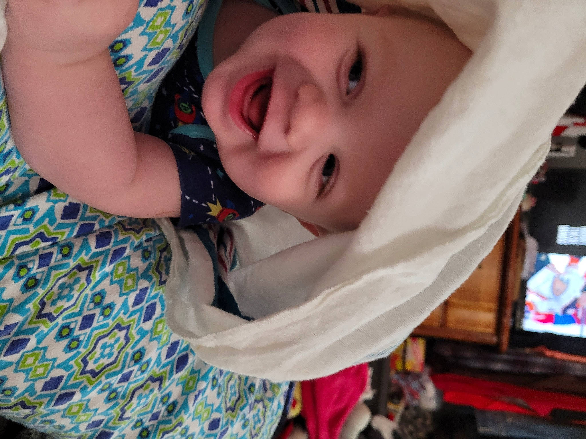 Killian is registered to the contest to win money with this photo: baby, baby_products, baby_toddler_clothing, blue, cheek, child, eye, eyelash, facial_expression, fashion_accessory, fun, grass, happy, headwear, lip, nose, pattern, person, skin, smile