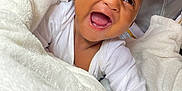 Daharei joined the competition — help win amazing prizes! baby, smiling, laughing, blanket, plush_toys, white_clothing, cute, happy, infant, cozy, indoor, child, face, portrait, soft_texture, warm, joy, newborn, comfort, playful