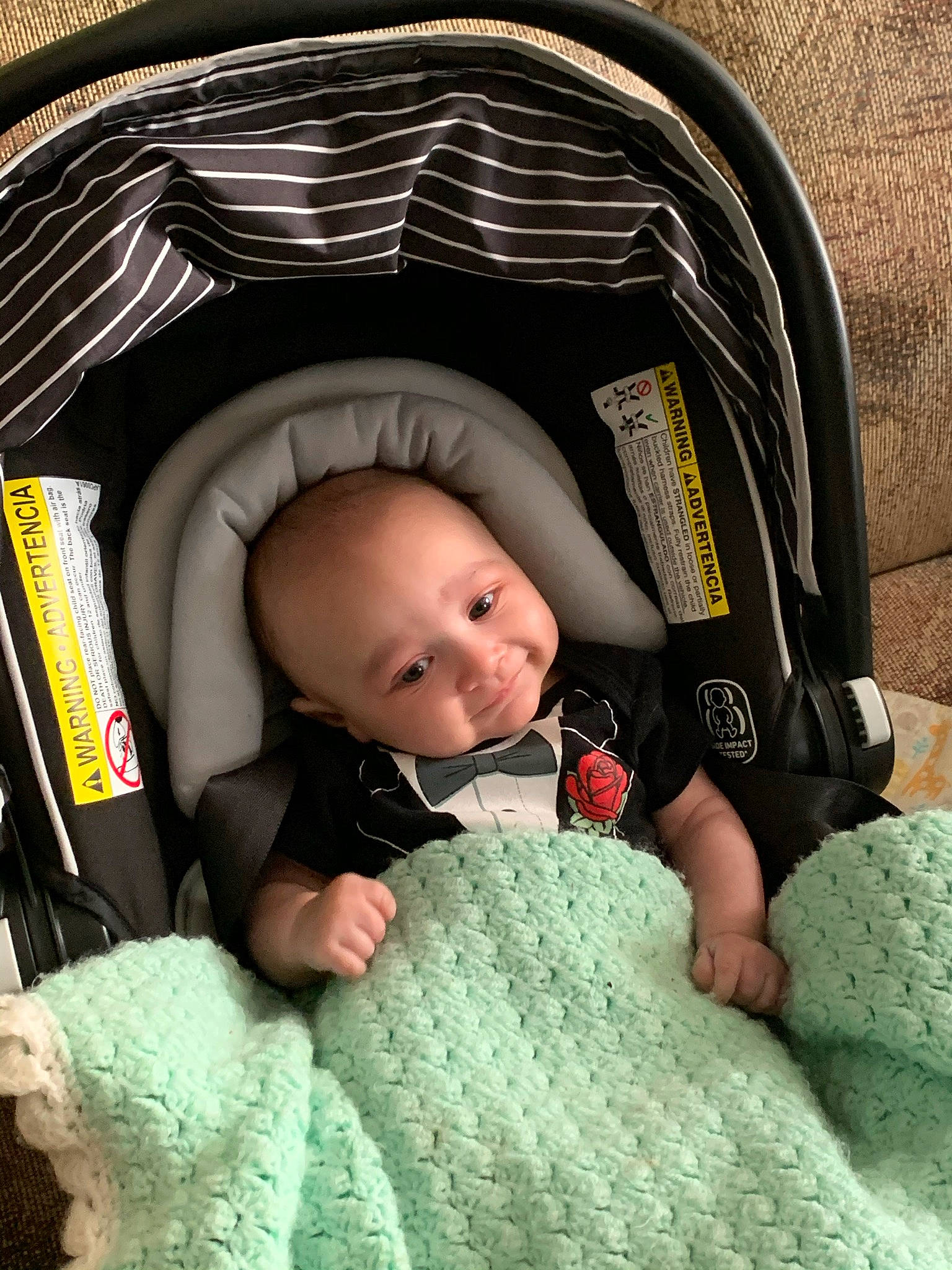 Jasiah is registered to the contest to win money with this photo: baby, baby_sleeping, baby_toddler_clothing, black, cheek, child, comfort, cool, finger, green, headgear, mouth, organ, outerwear, person, photograph, product, skin, smile, snapshot