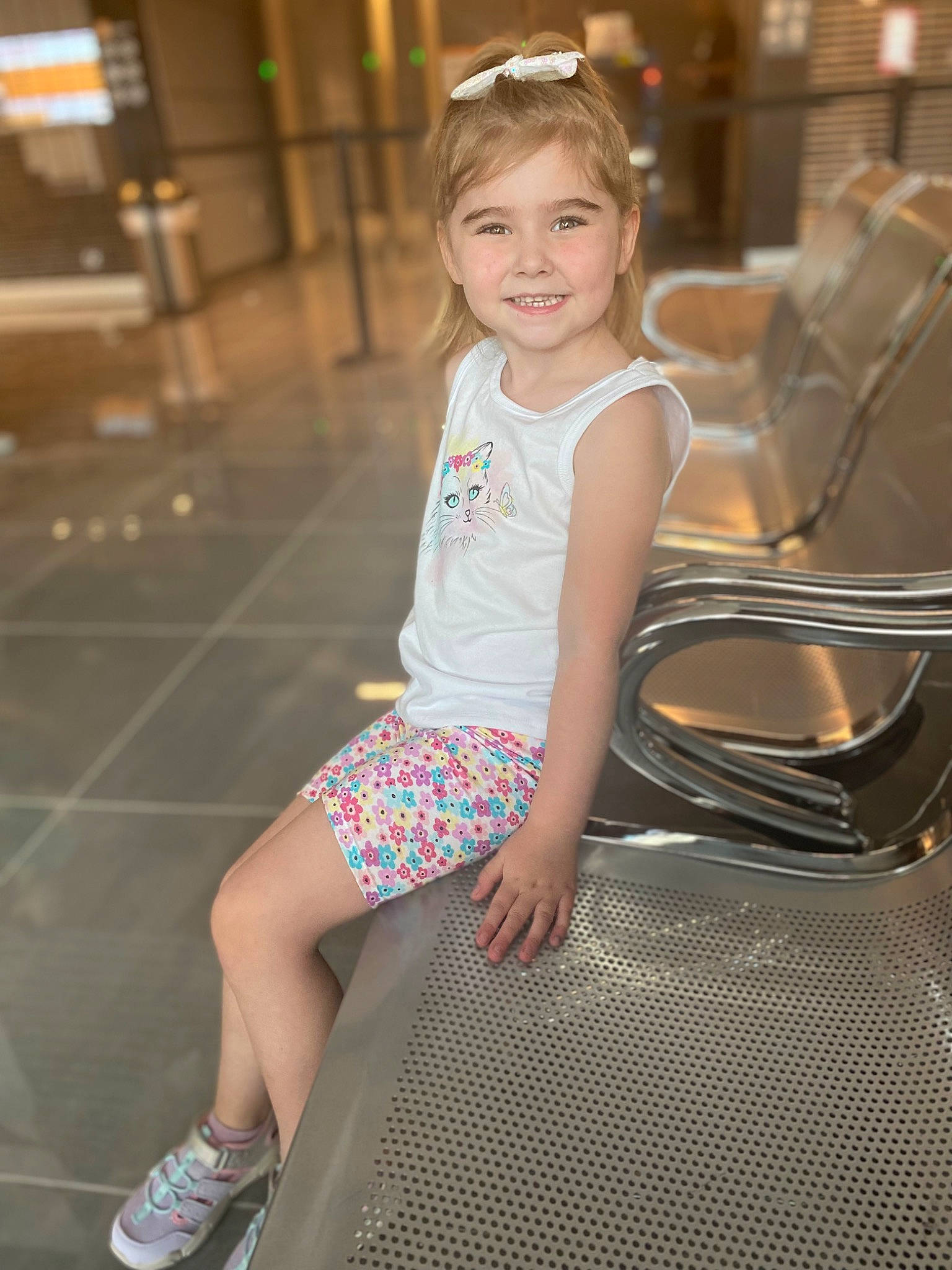 Blakely joined the competition — help win amazing prizes! blond, brown_hair, flash_photography, fun, happy, human_leg, joy, knee, leg, leisure, long_hair, pattern, person, sandal, shoe, sitting, smile, sneakers, t_shirt, thigh