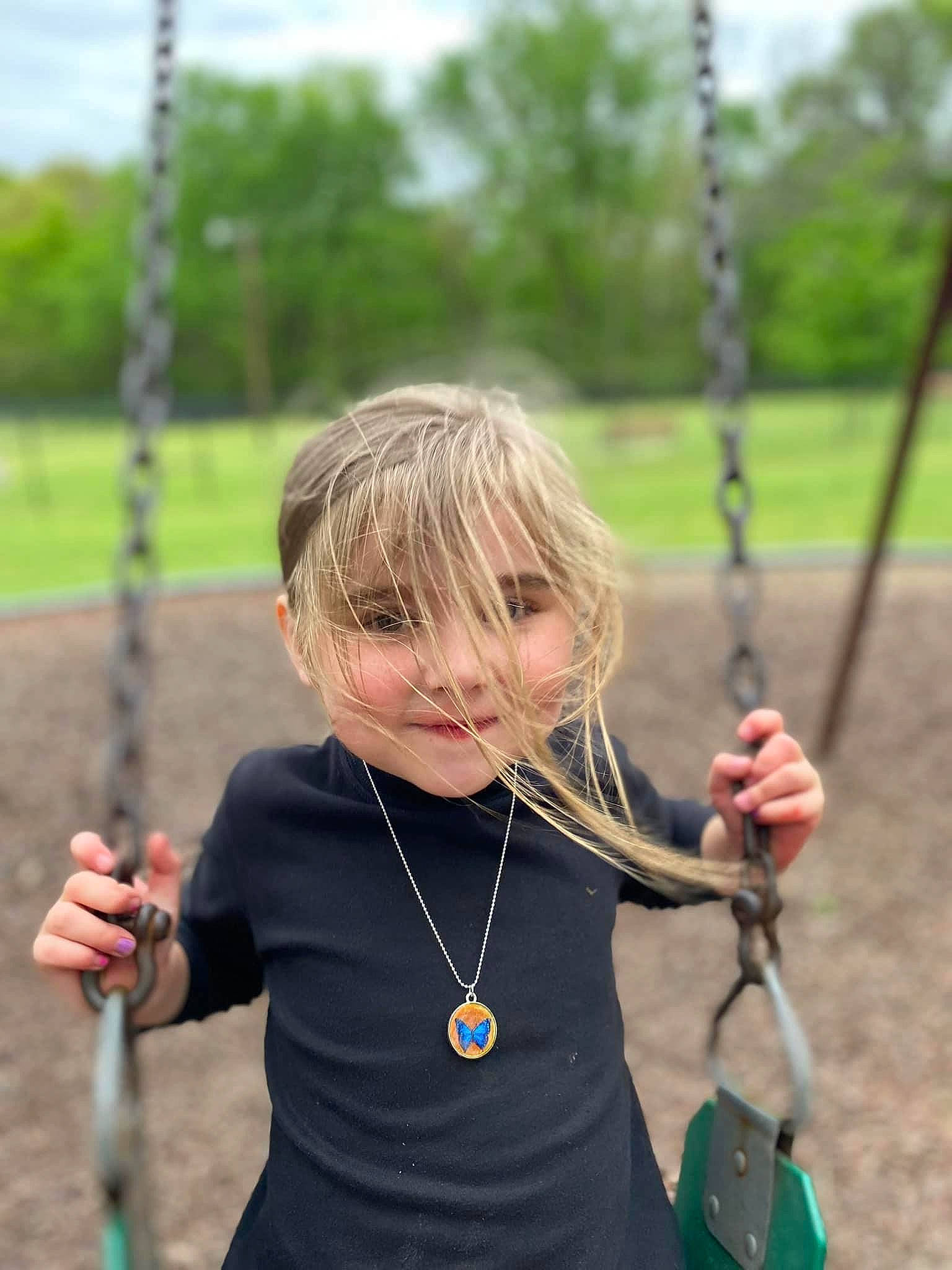 Blakely joined the competition — help win amazing prizes! arm, blue, fun, grass, green, hand, happy, leisure, natural_environment, nature, people, person, photograph, playground, public_space, recreation, standing, summer, swing, toddler