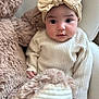 baby, child, teddy_bear, headband, bow, knitwear, beige, cream, soft, cuddly, portrait, indoor, cute, infant, cozy, plush, face, person, young, seated