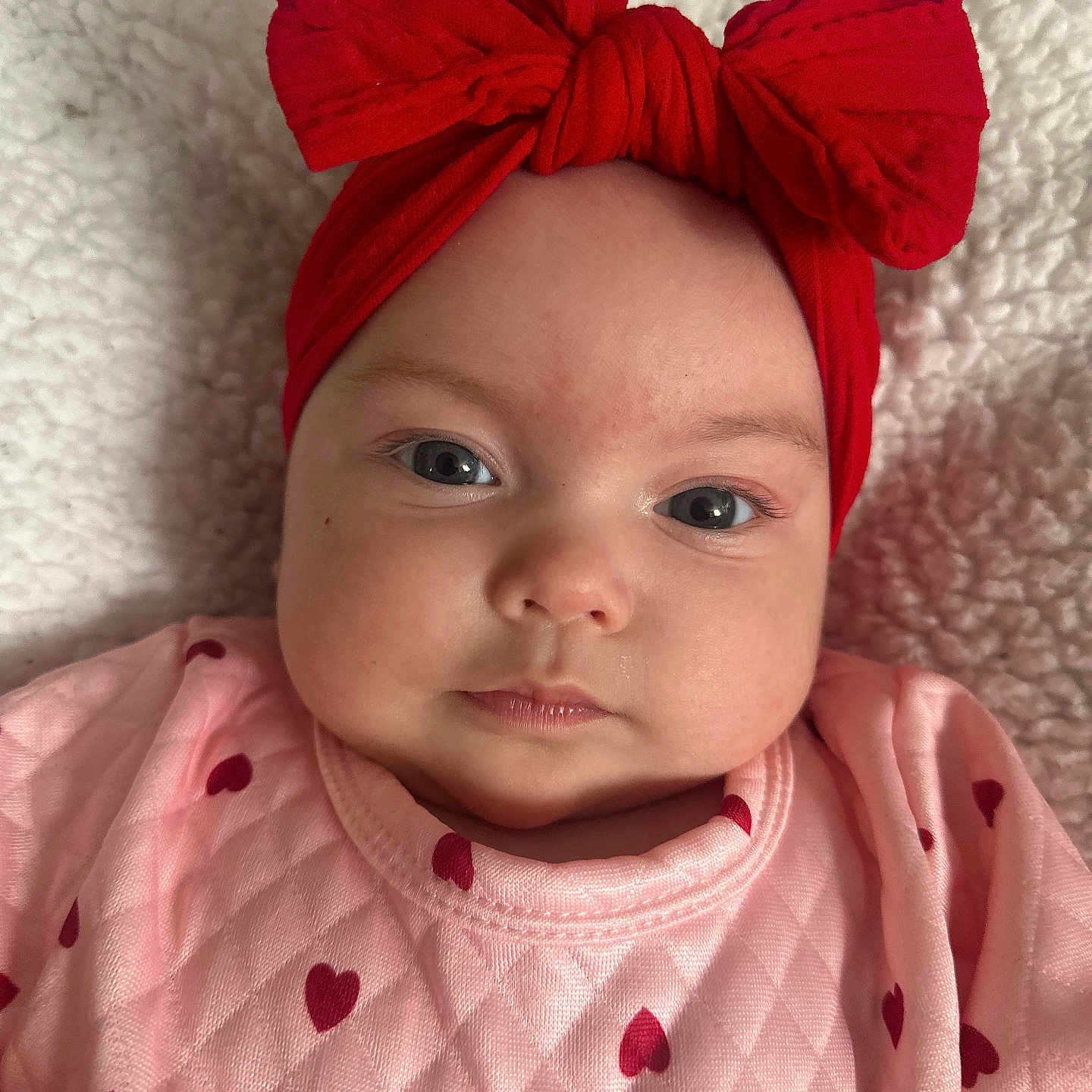 Amelia is registered to the contest to win money with this photo: accessories, baby, bonnet, clothing, dahlia, dress, face, flower, happy, hat, head, headband, newborn, person, photography, plant, portrait, scarf, smile, turban
