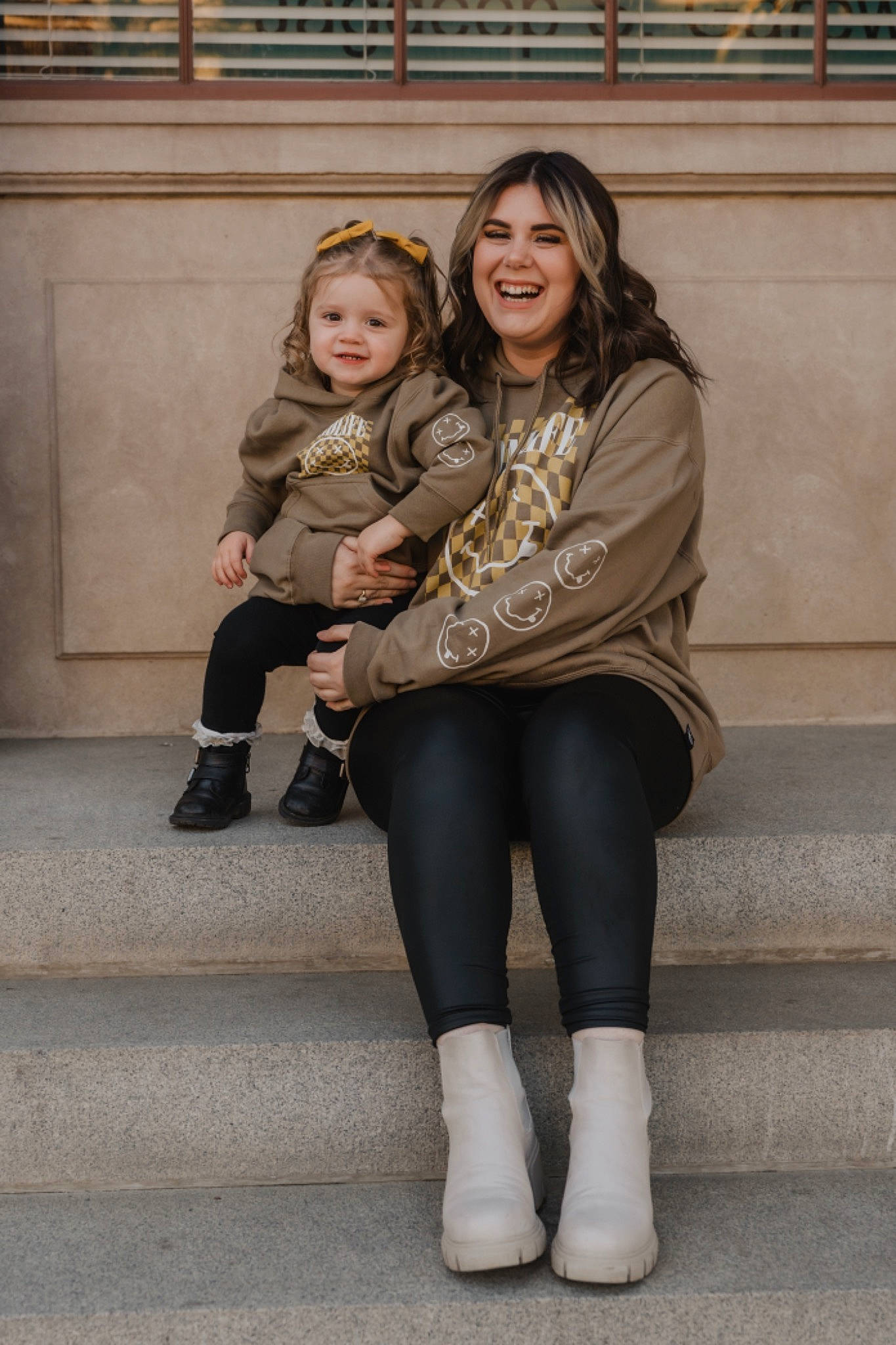 Harleigh is registered to the contest to win money with this photo: blond, event, facial_expression, flash_photography, fun, hair, hairstyle, happy, human_leg, jewellery, joint, joy, knee, person, shoe, shoulder, sitting, skin, smile, sock