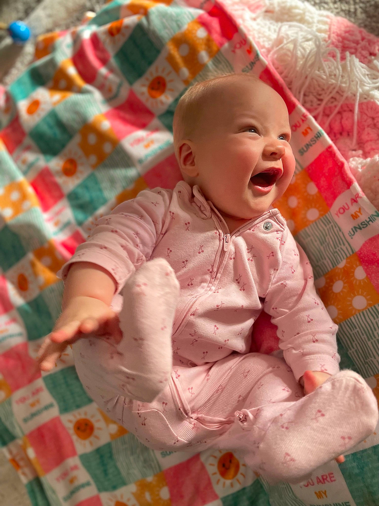 Alaina is registered to the contest to win money with this photo: art, baby, baby_products, baby_toddler_clothing, baby_toys, cheek, child, eye, happy, linens, pattern, person, pink, plaid, sitting, skin, sleeve, smile, tartan, toddler
