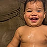 baby, bare_chested, child, closeup, couch, cushion, eyes, face, hair, happy, home, indoor, laughing, photography, playful, portrait, sitting, smiling, teeth, toddler