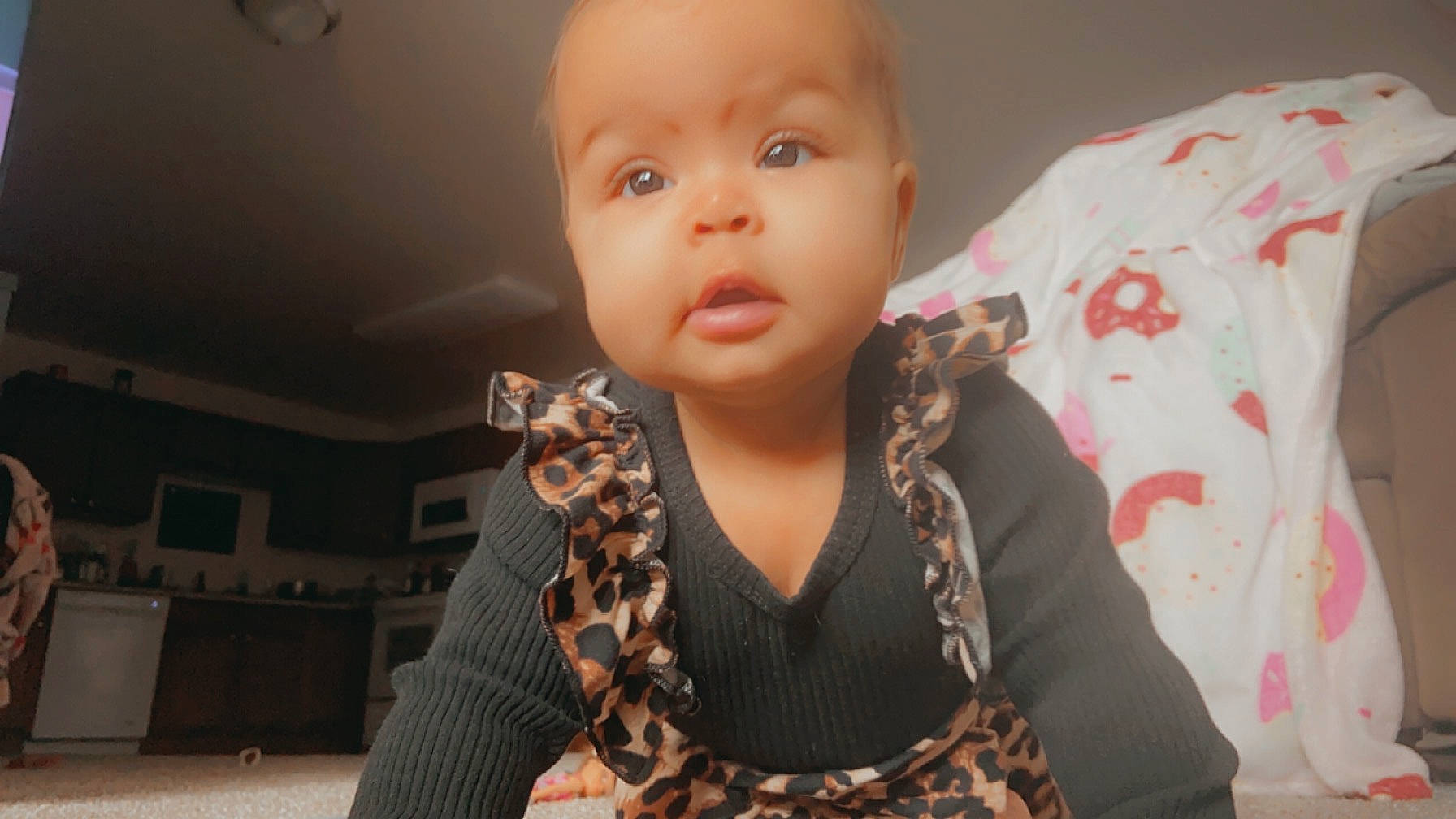 Elizabeth is registered to the contest to win money with this photo: arm, baby, baby_toddler_clothing, body_jewelry, cheek, child, design, ear, eyelash, fashion_accessory, fashion_design, gesture, happy, human_body, jewellery, neck, pattern, person, sleeve, t_shirt