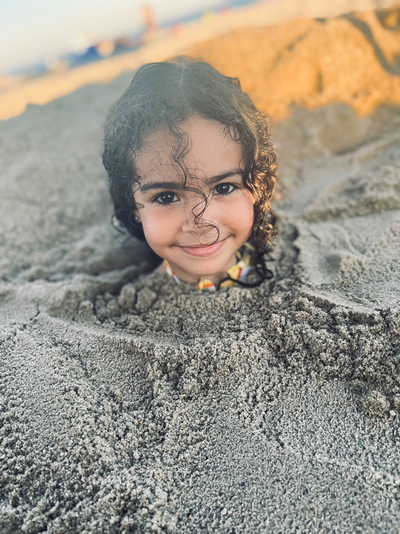 Bryelle is registered to the contest to win money with this photo: aeolian_landform, asphalt, beach, close_up, flash_photography, fun, geological_phenomenon, geology, happy, joy, landscape, ocean, people_in_nature, person, rock, sand, shadow, soil, toy, wave