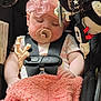 Emmaline is registered to the contest to win money with this photo: baby, sleeping, pacifier, car_seat, blanket, headband, toy, child, infant, safety_harness, pink, soft, cute, resting, peaceful, clothing, hand, face, indoor, closeup