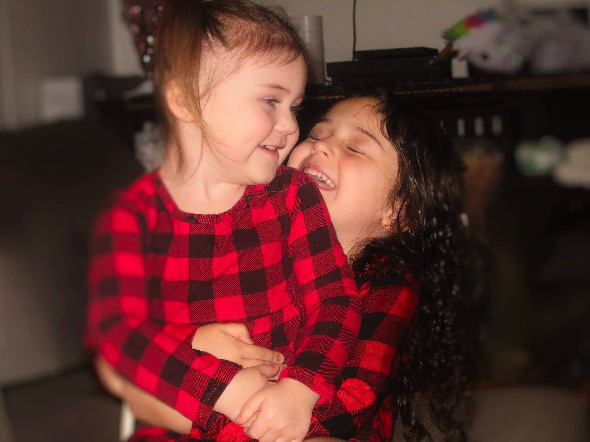 Elizabeth is registered to the contest to win money with this photo: child, ear, event, flash_photography, fun, gesture, hair, hairstyle, happy, holiday, hug, joy, laugh, love, pattern, person, plaid, sleeve, smile, tartan