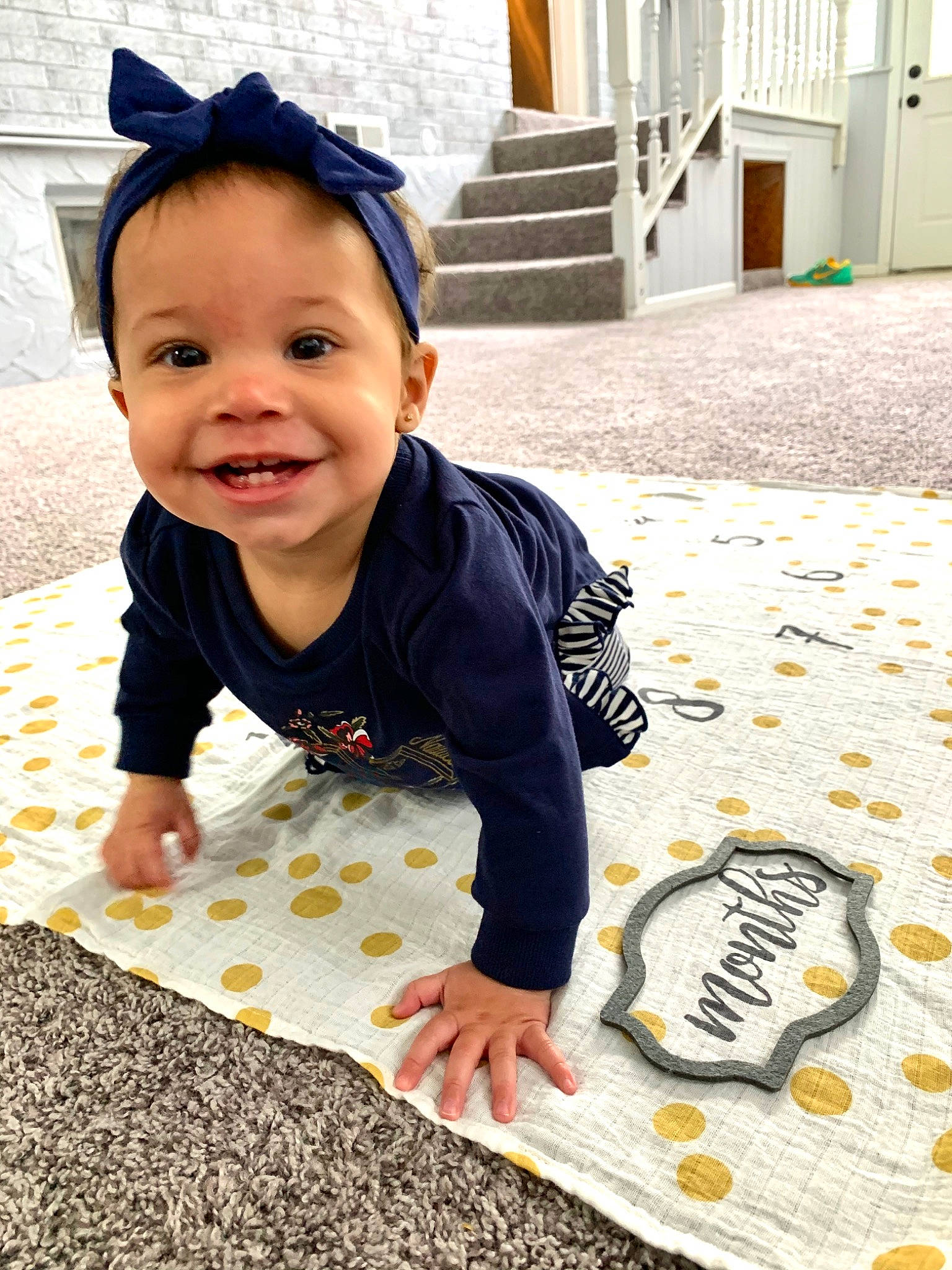 Jayde joined the competition — help win amazing prizes! baby, baby_toddler_clothing, child, crawling, floor, flooring, headgear, joy, person, play, sleeve, smile, t_shirt, toddler, yellow