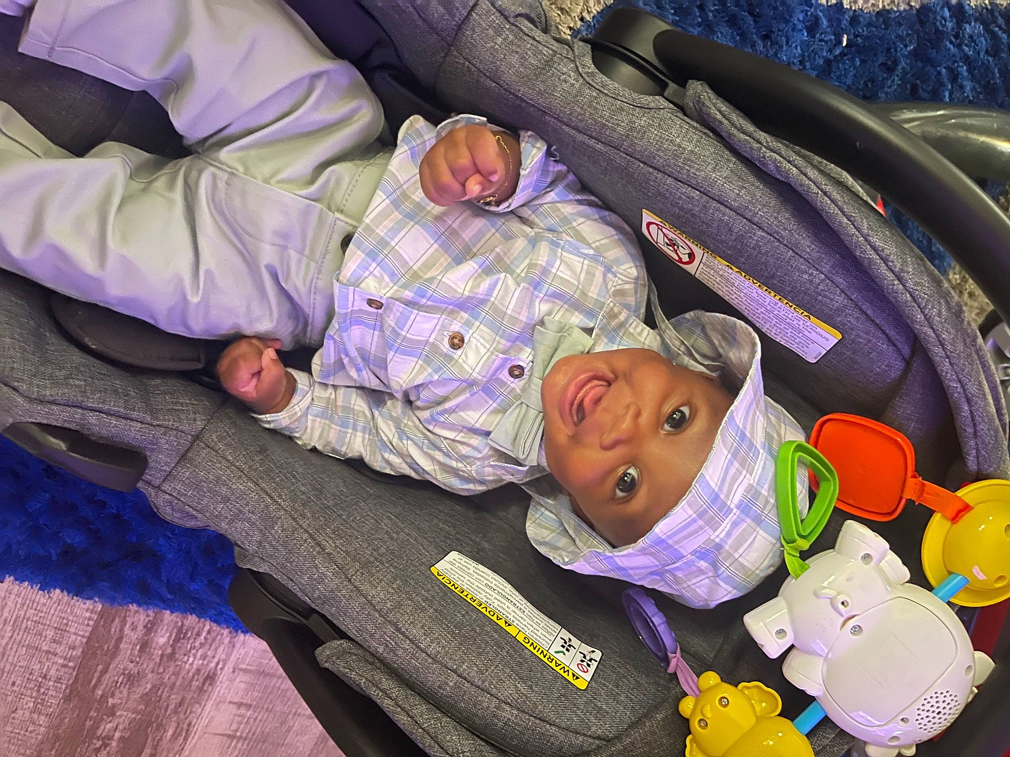 Karson is registered to the contest to win money with this photo: baby, baby_products, car_seat, child, comfort, hat, head, headwear, linens, nap, passenger, pattern, person, purple, room, sitting, sleep, stuffed_toy, toddler, toy