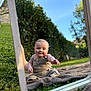 baby, child, mirror, reflection, outdoor, grass, blanket, smile, happy, nature, sunny, blue_sky, greenery, overalls, cute, portrait, sitting, daylight, wooden_frame, curious