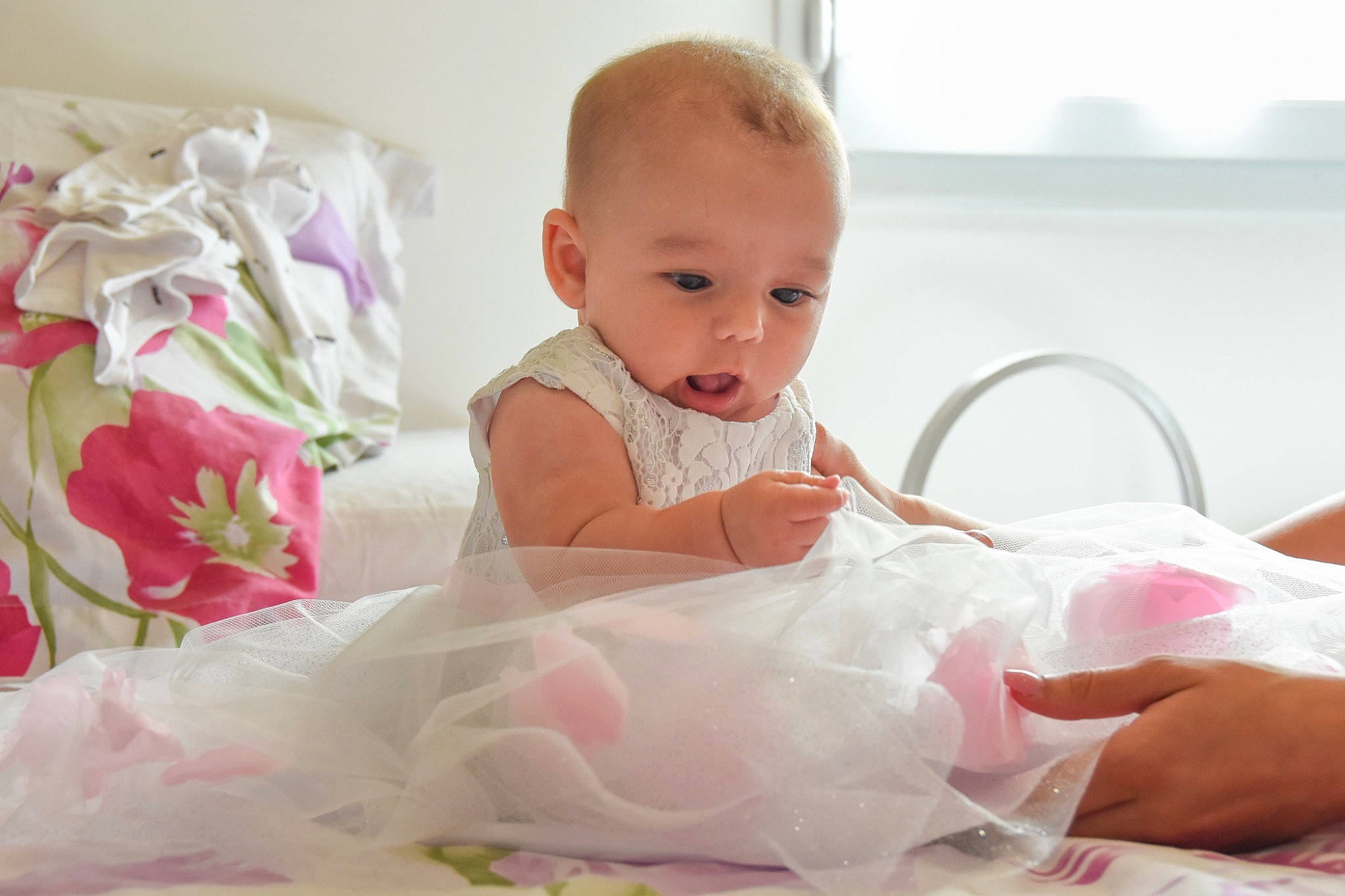 Maddy participe au concours pour gagner de l'argent avec cette photo : baby, baby_products, baby_toddler_clothing, bedding, child, comfort, event, fashion_accessory, happy, linens, magenta, peach, person, petal, pink, product, room, sitting, skin, textile