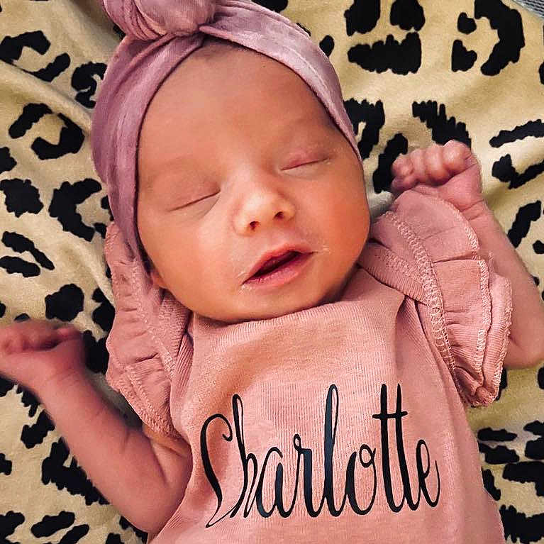 Charlotte is registered to the contest to win money with this photo: baby, blanket, bonnet, clothing, cushion, face, hat, head, homedecor, hoodie, knitwear, newborn, person, photography, portrait, quilt, skin, sleeping, tattoo, yawning