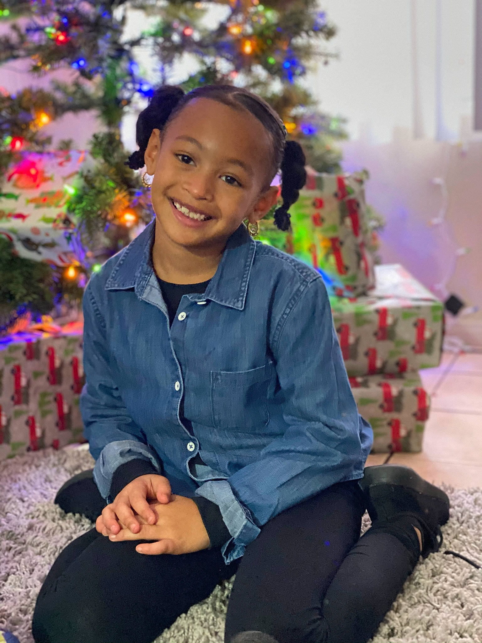 Julani is registered to the contest to win money with this photo: christmas_decoration, christmas_ornament, christmas_tree, clothing, electric_blue, event, eye, face, flash_photography, fun, happy, head, holiday, human_body, joy, person, purple, sitting, sleeve, smile