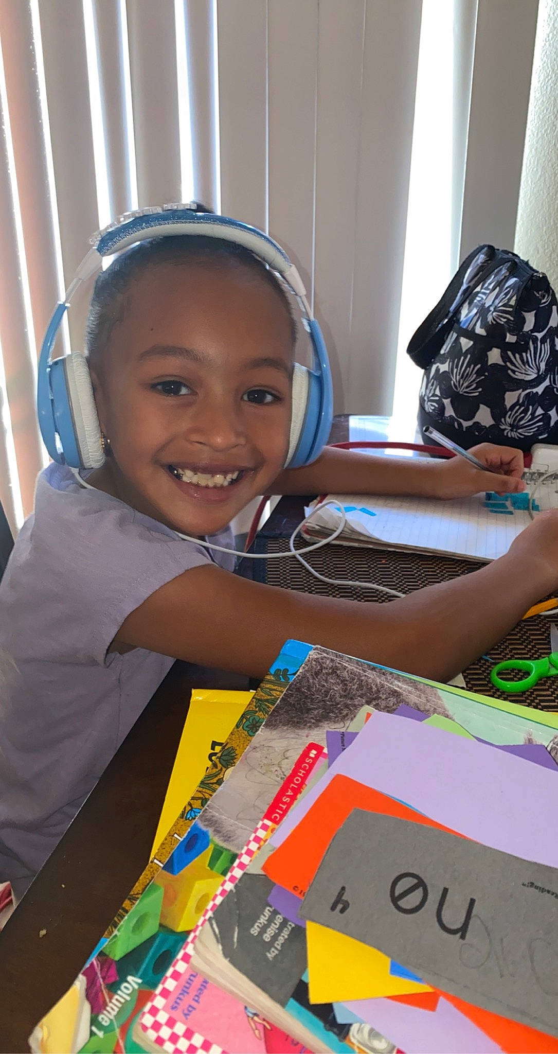 Julani joined the competition — help win amazing prizes! audio_equipment, black, child, electronic_device, event, fashion_accessory, fun, happy, joy, laugh, leisure, office_equipment, person, play, recreation, room, smile, t_shirt, table, technology