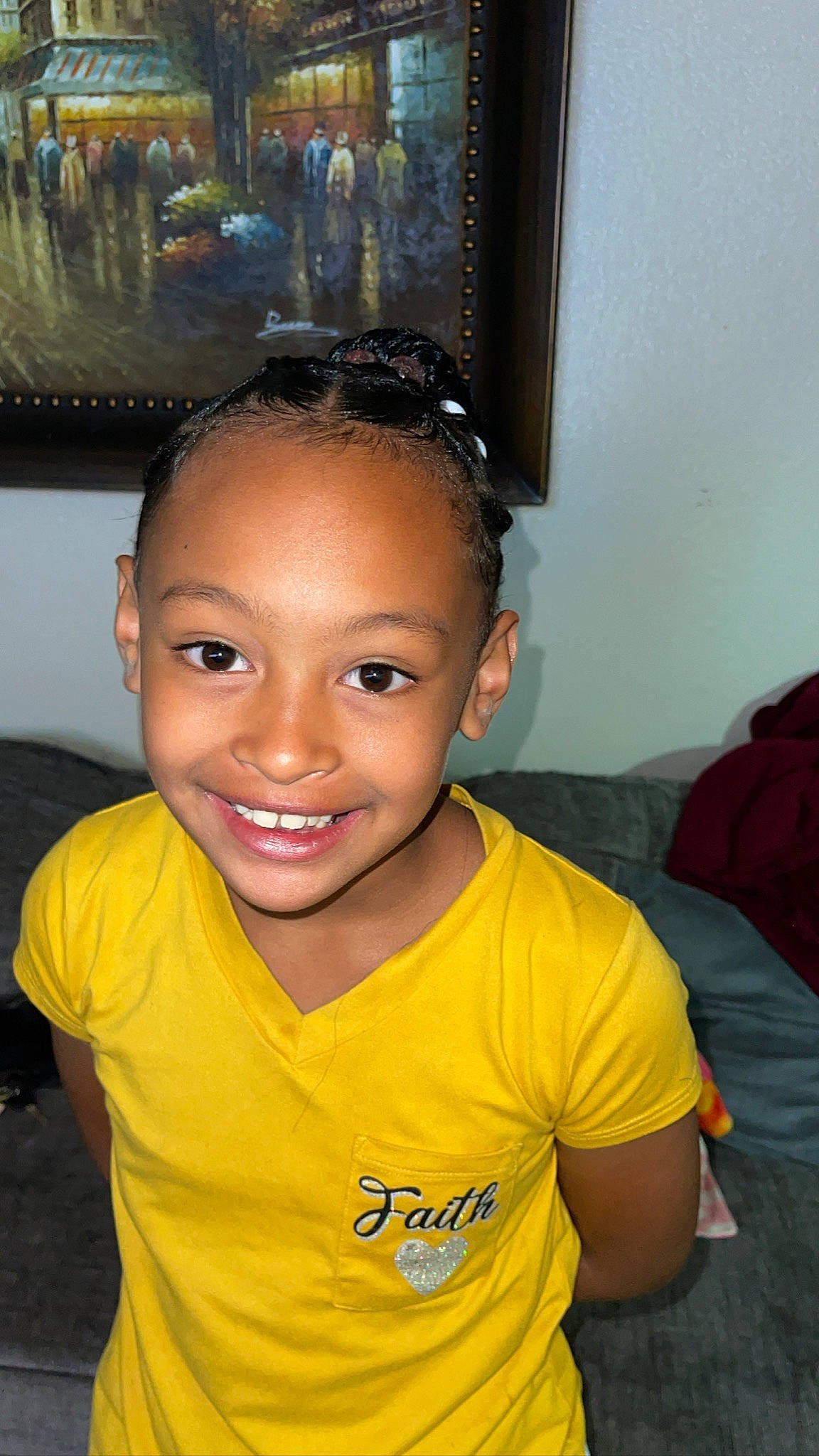 Julani is registered to the contest to win money with this photo: art, black_hair, cheek, child, cool, ear, eyebrow, eyelash, flash_photography, forehead, fun, happy, iris, joy, nose, person, picture_frame, room, sitting, smile