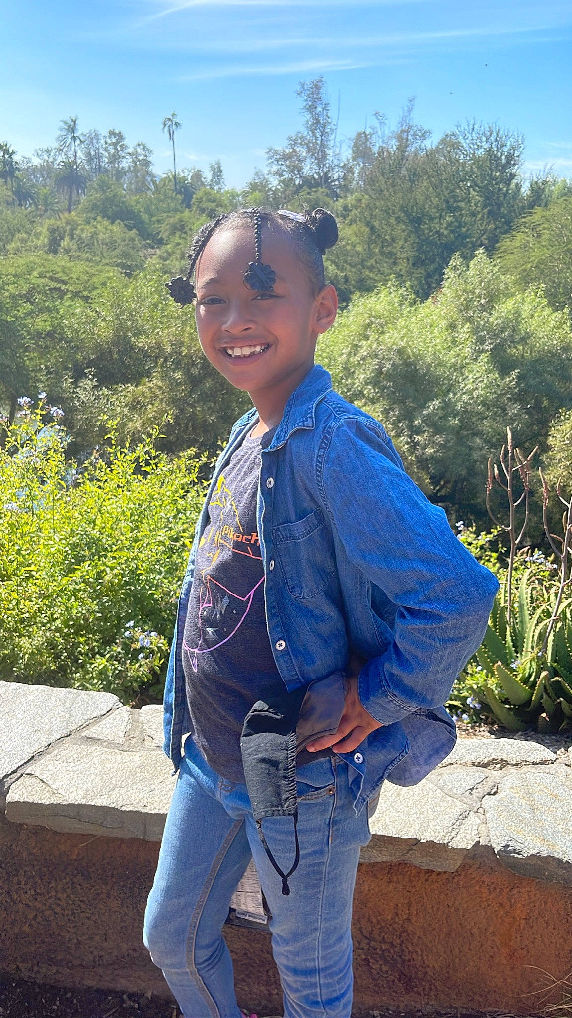 Julani joined the competition — help win amazing prizes! azure, denim, electric_blue, eyewear, goggles, grass, hat, jeans, joy, landscape, leisure, person, plant, sky, sleeve, smile, standing, sunglasses, travel, tree